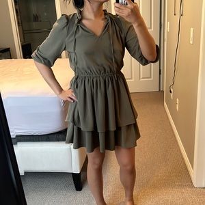 Tiered taupe dress with neck bow.